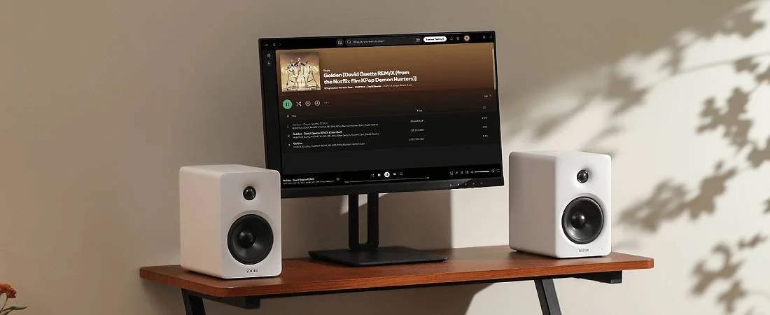 Black Edifier M90 speakers on a desk